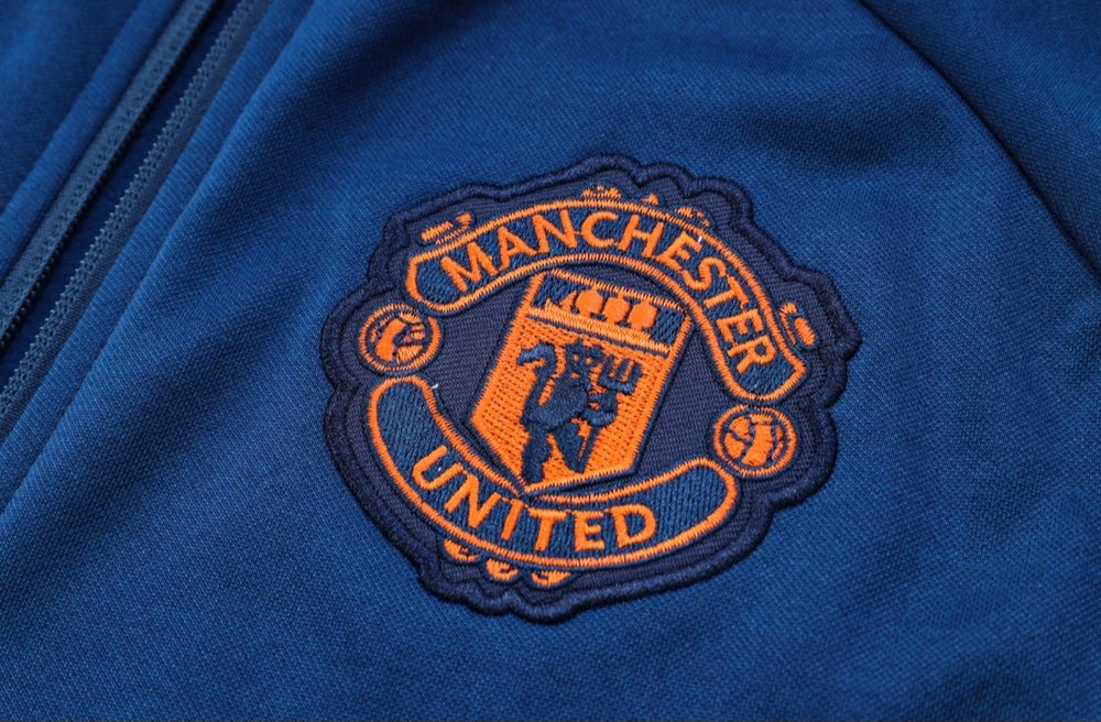 24/25 Manchester United Dark Blue Premium Tracksuit - Premium Quality Jersey at FootballPrestige.com